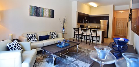 a living room with a couch and a table